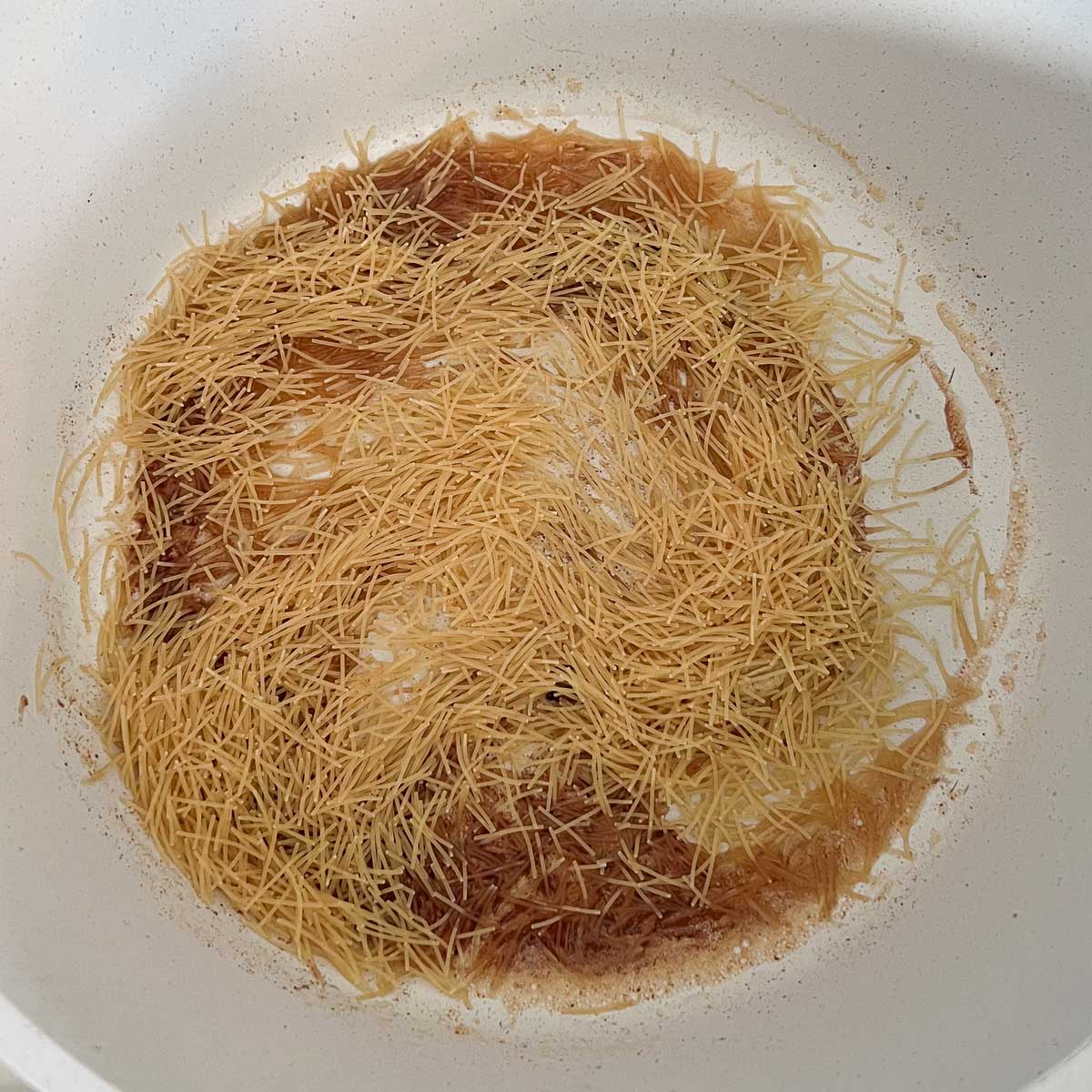 vermicelli noodles added to pot.