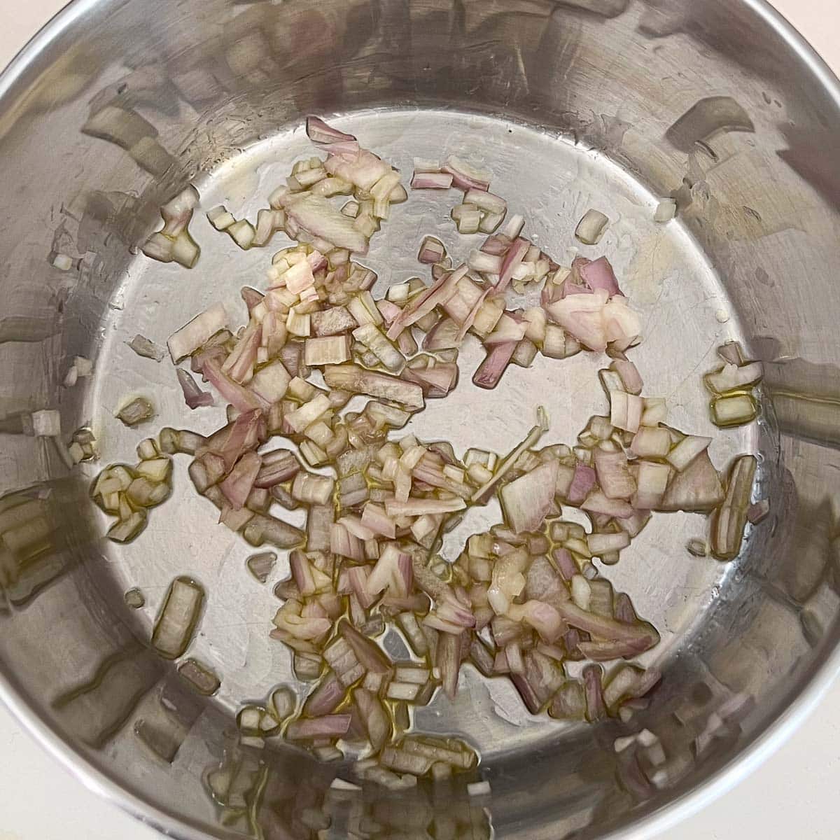diced shallots sautéing in saucepan.