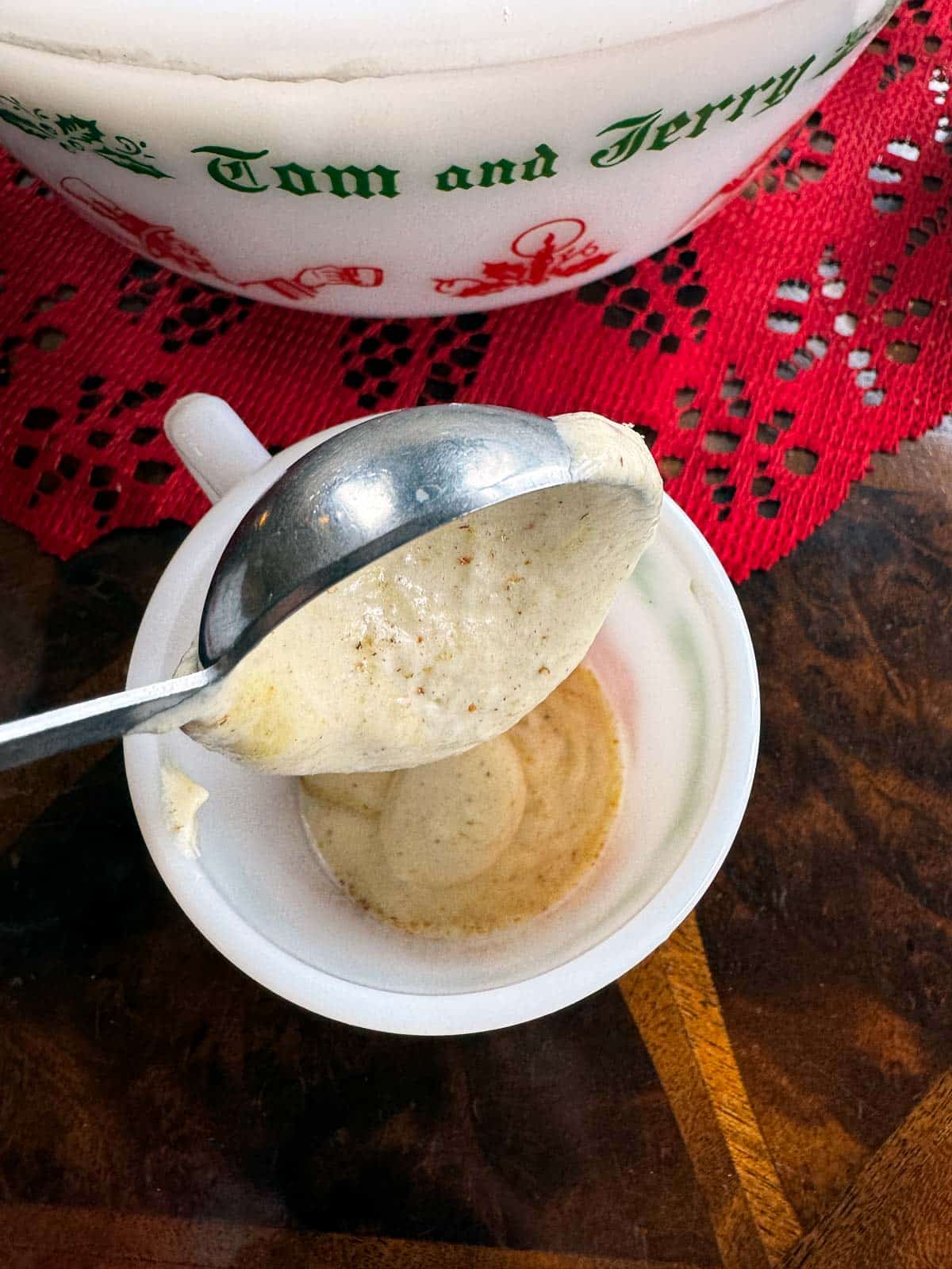 pouring batter into mug.