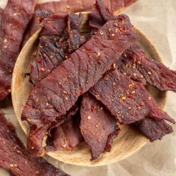 smoked beef jerky in a wooden bowl.