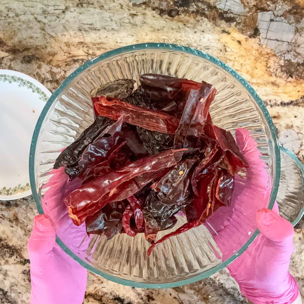 dried chiles in a glass bowl.