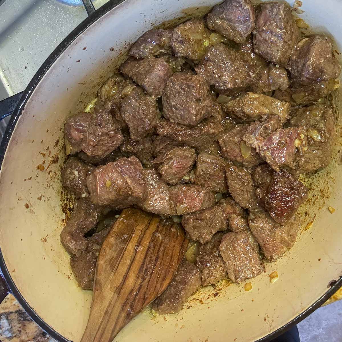 cooked meat in a pot for chile colorado. 