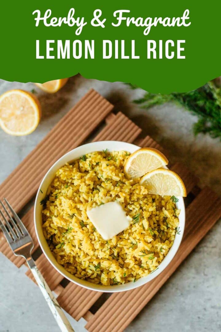 lemon dill rice in bowl with fork, sliced lemons and fresh dill off to the side.