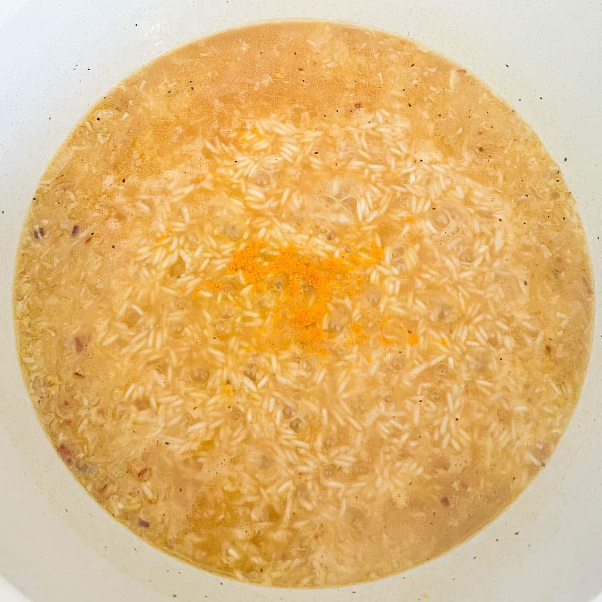 broth and spices added to the rice.