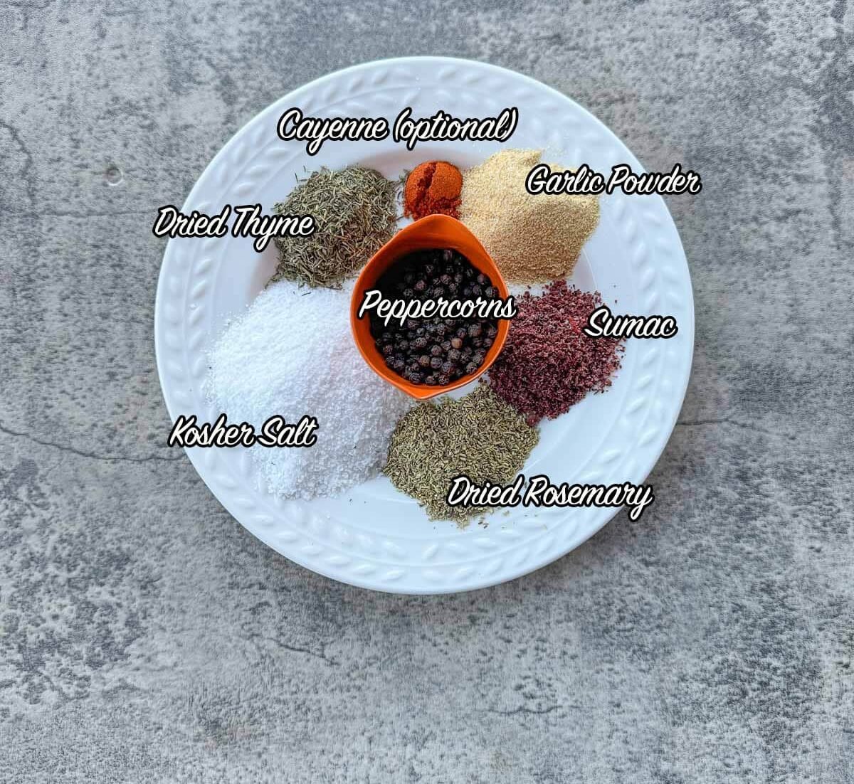 steak seasoning spices on a white plate.