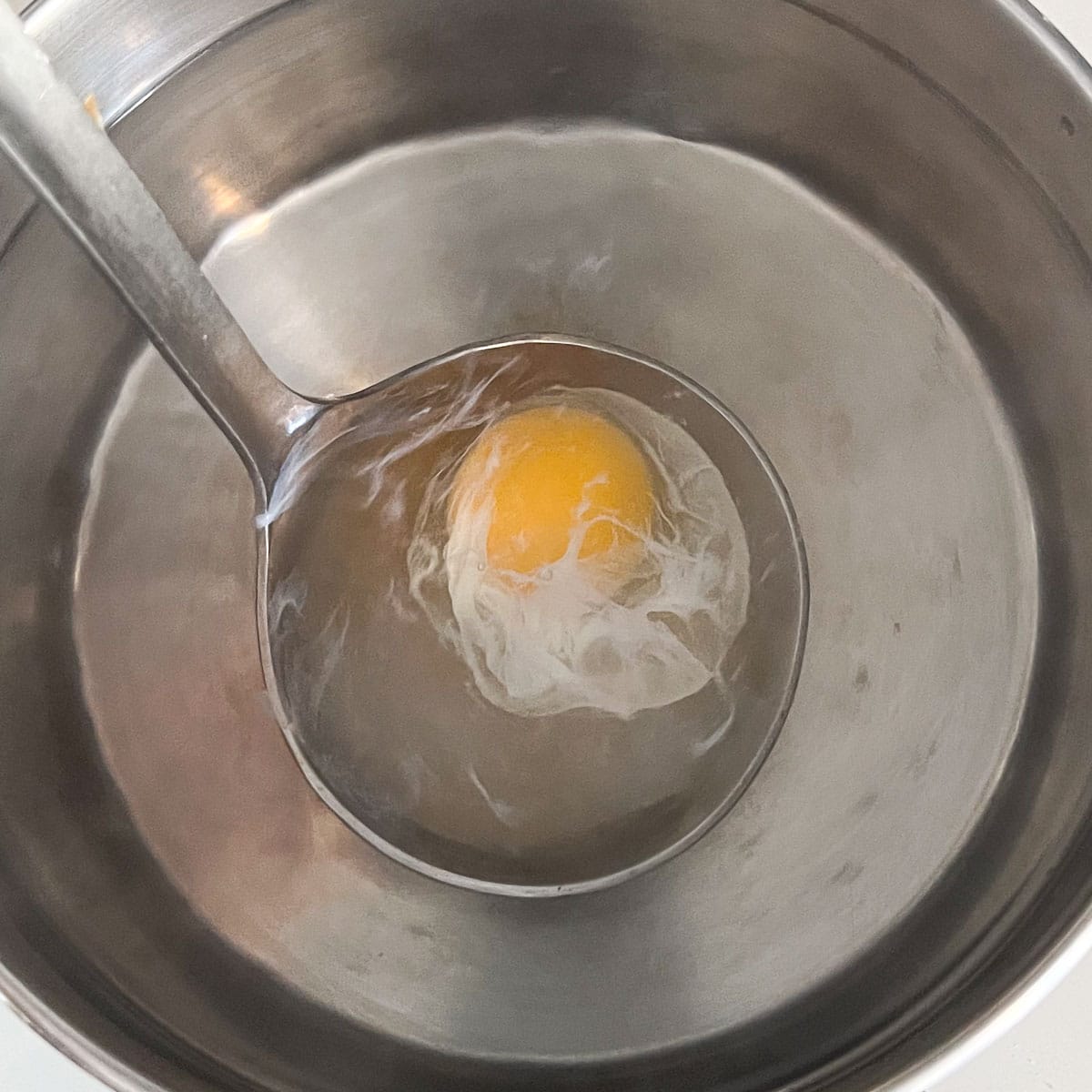 poached egg forming while still in the ladle.