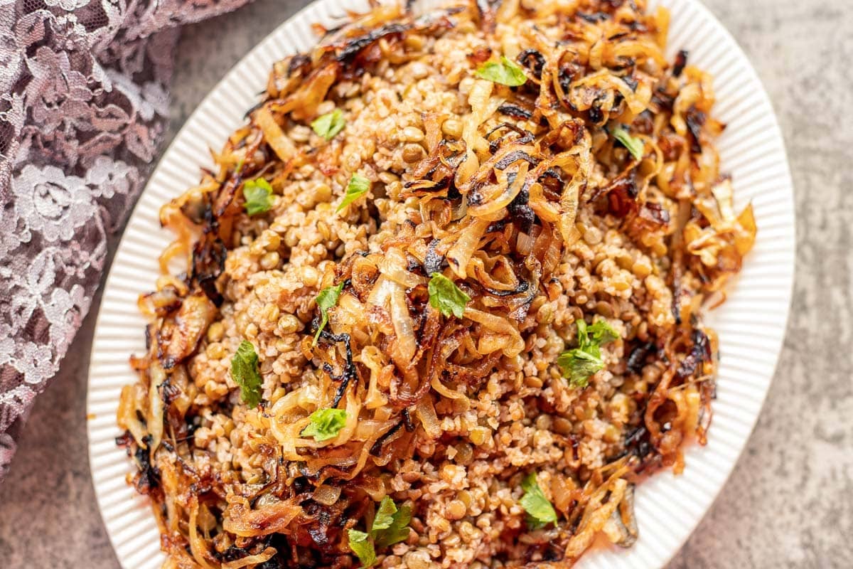 Lebanese Mujadara recipe on a white plate.