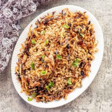 Lebanese Mujadara (lentil and bulgur) covered with caramelized onions.