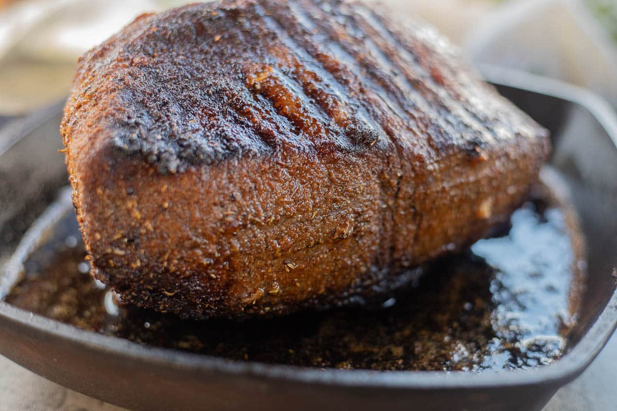 baked bottom round roast in a cast iron pan.