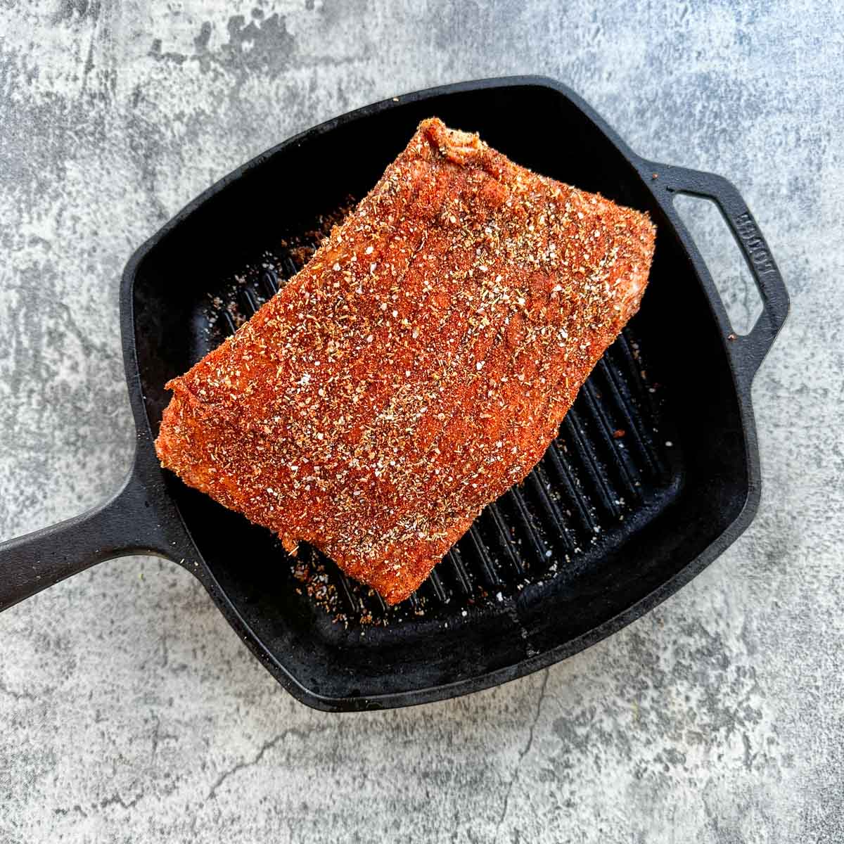 seasoned rump roast on a cast iron skillet.