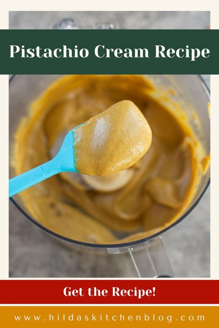 pistachio cream being removed from food processor.