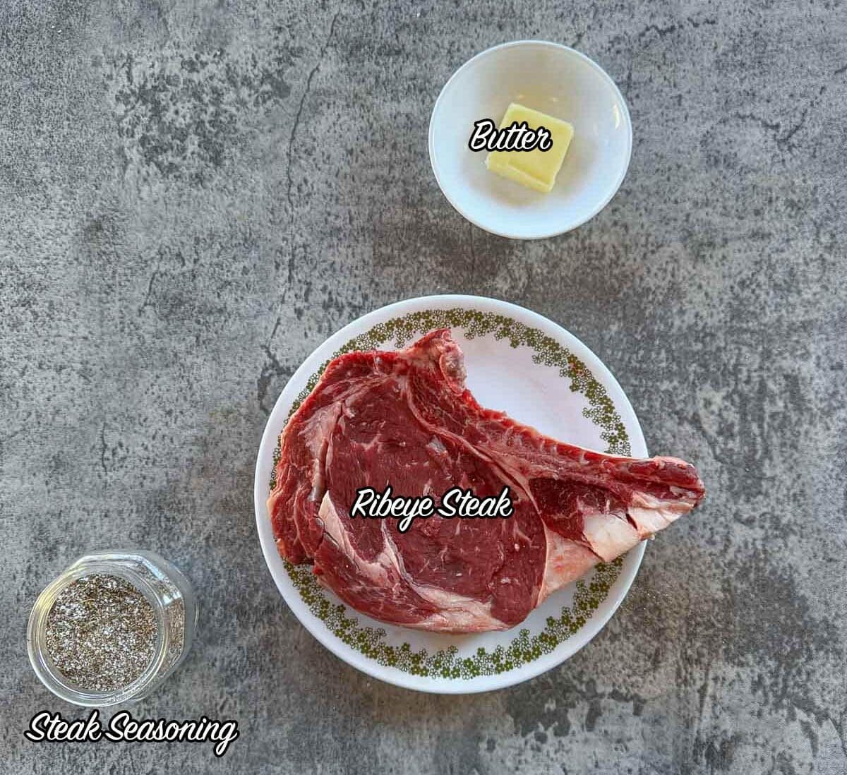 smoked steak ingredients including steak, seasoning, and butter.