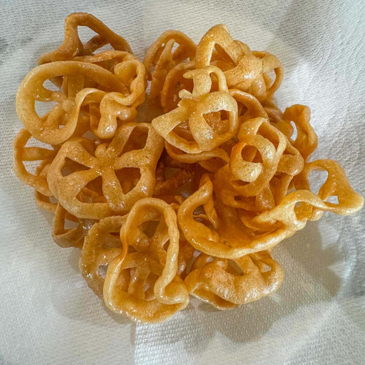 chicharrones draining on napkins.