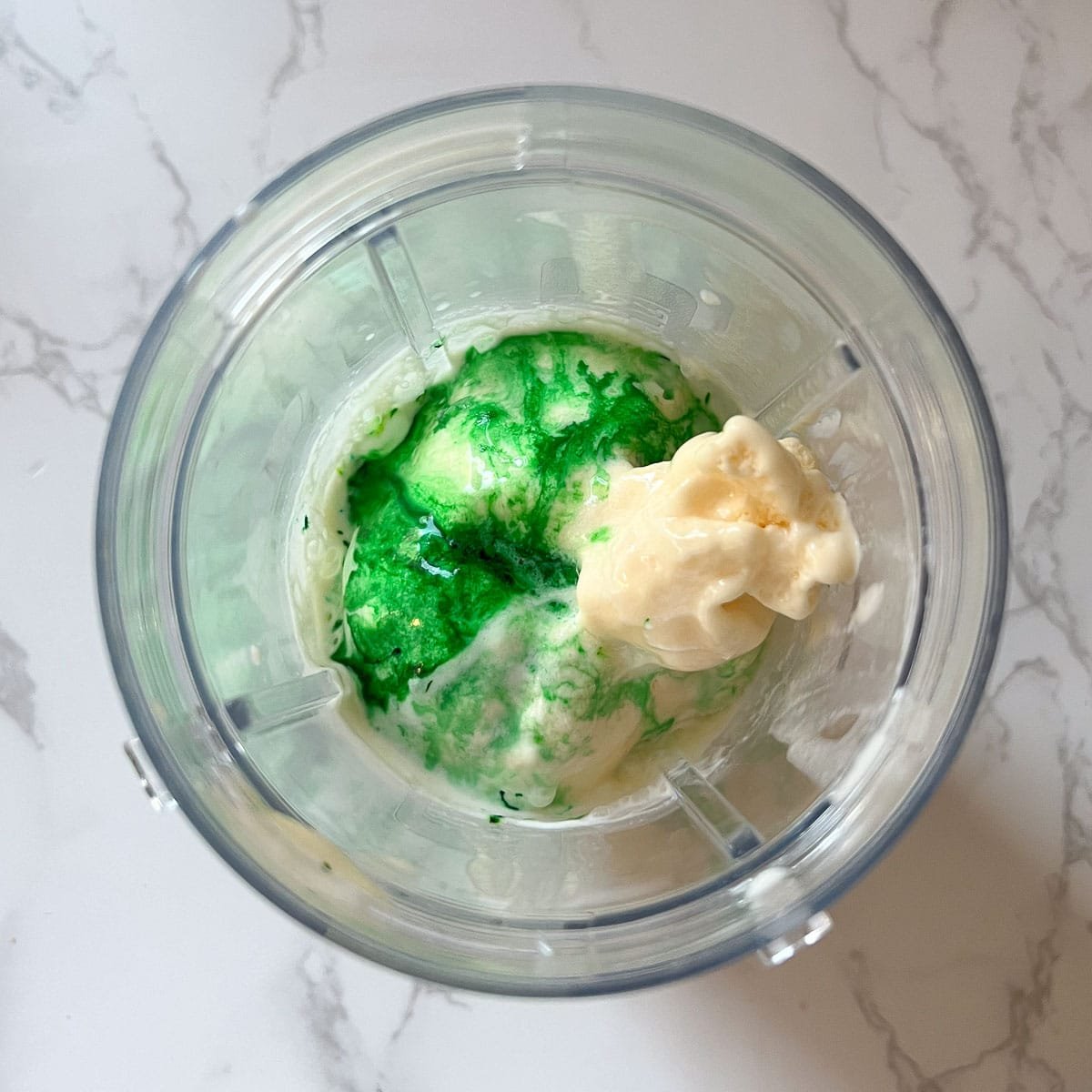 homemade shamrock shake recipe ingredients in ninja blender before blending. 