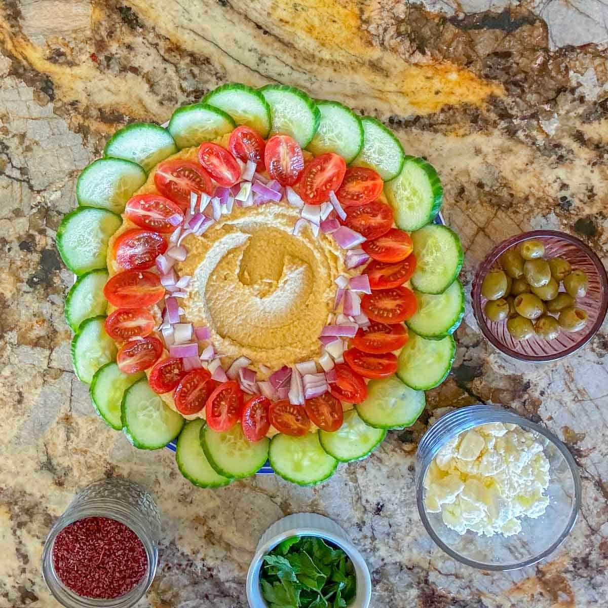 loaded hummus being assembled.