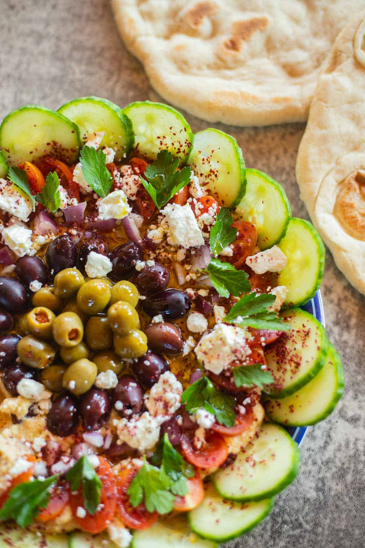 loaded hummus with pita bread.