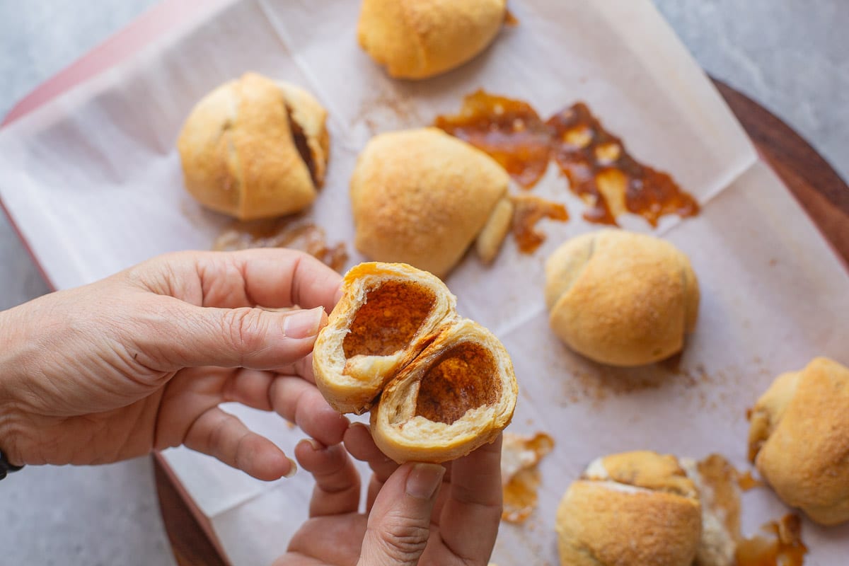 resurrection rolls being split in half to reveal the hollow center.