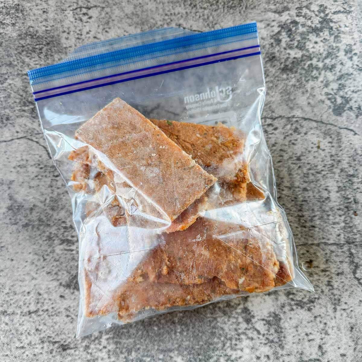 ziplock bag with sliced chicken gyro meat.