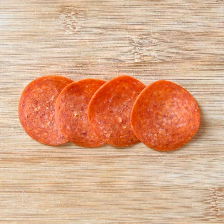 pepperoni slices overlapping in a line. 