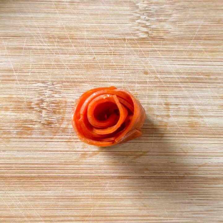 pepperoni rose on cutting board.