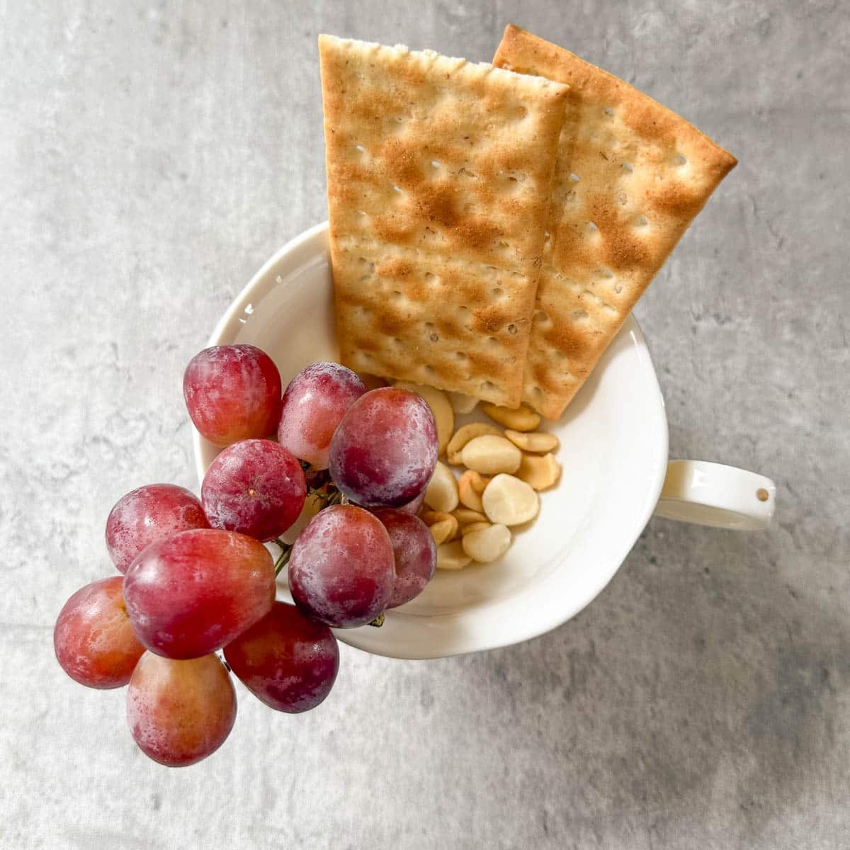 grapes and crackers added to cup.
