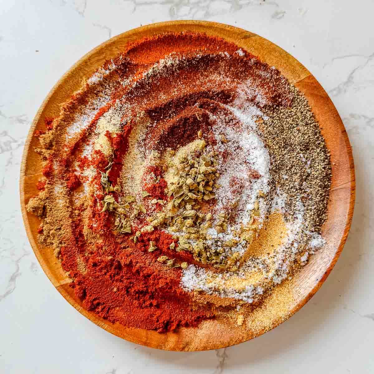 all chicken taco spices on plate (partially mixed).
