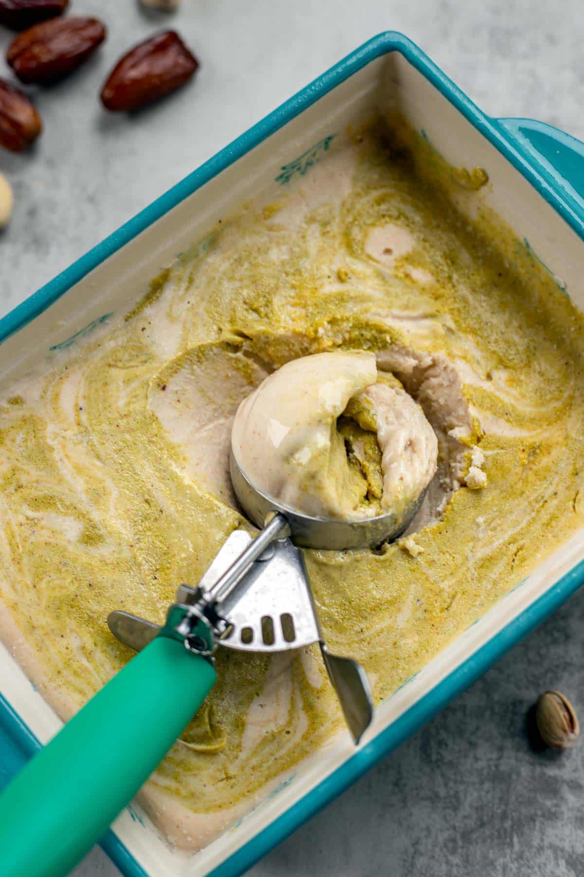 cottage cheese ice cream being scooped from dish.