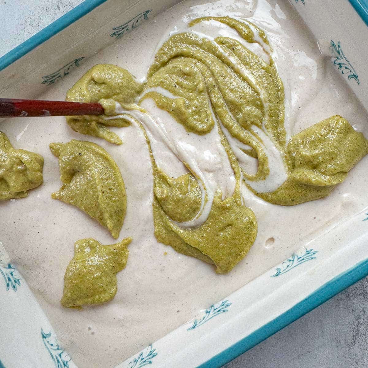 swirling pistachio cream into cottage cheese ice cream.