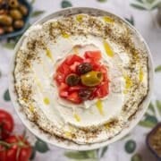 labneh dip with tomatoes and olives.