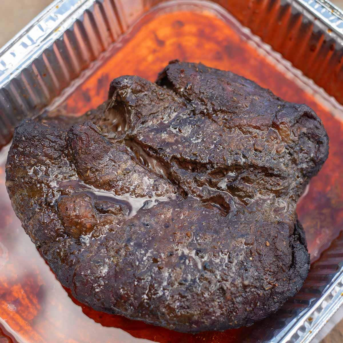 smoked chuck roast in a pan. 