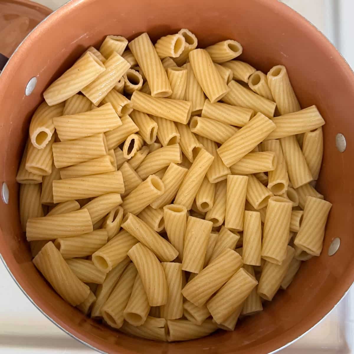 cooked and drained pasta in pot.