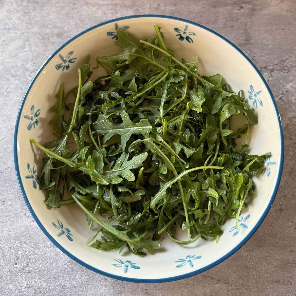 arugula base in salad bowl.