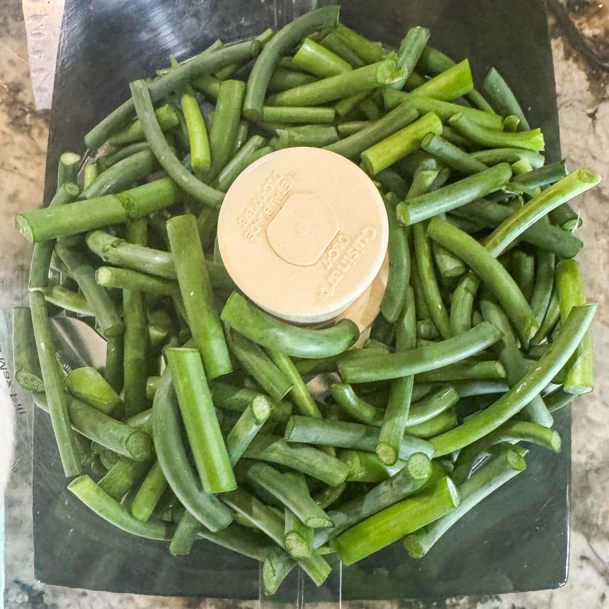 chopped garlic scapes in a food processor. 