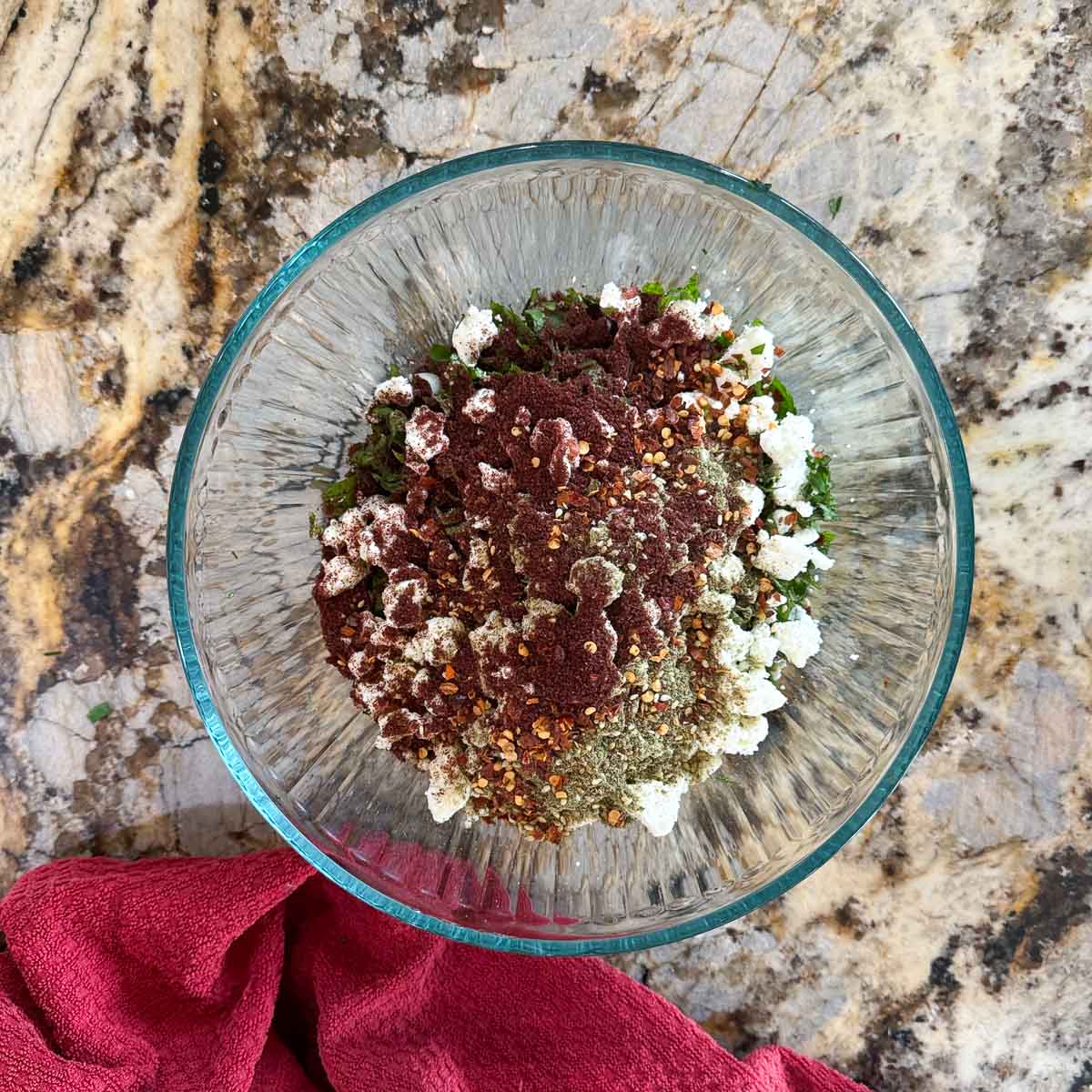 spinach and feta topping mix in a bowl.