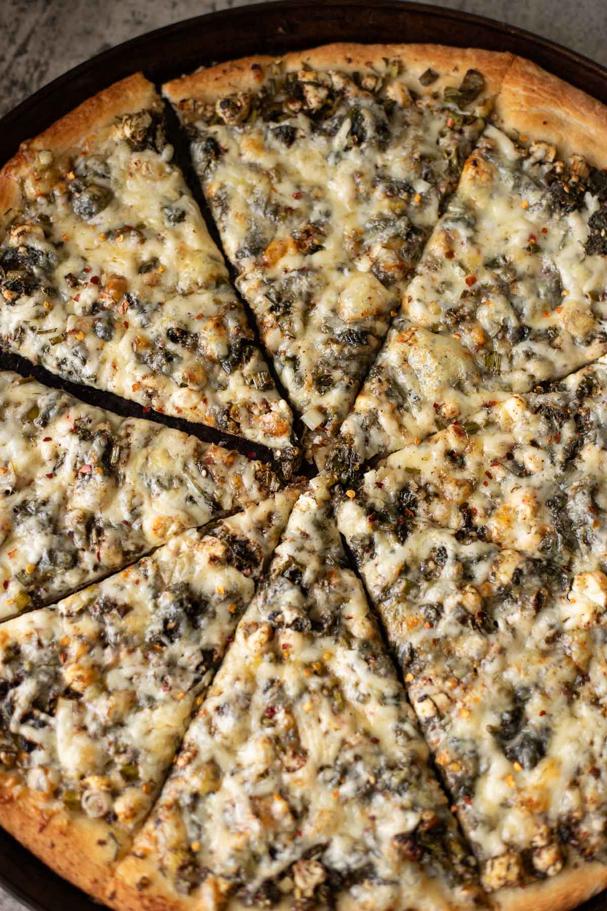 sliced spinach and feta pizza.
