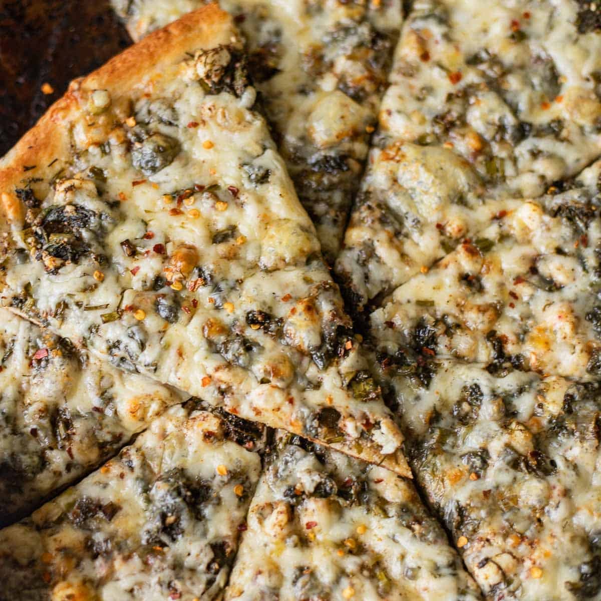 sliced spinach and feta pizza.