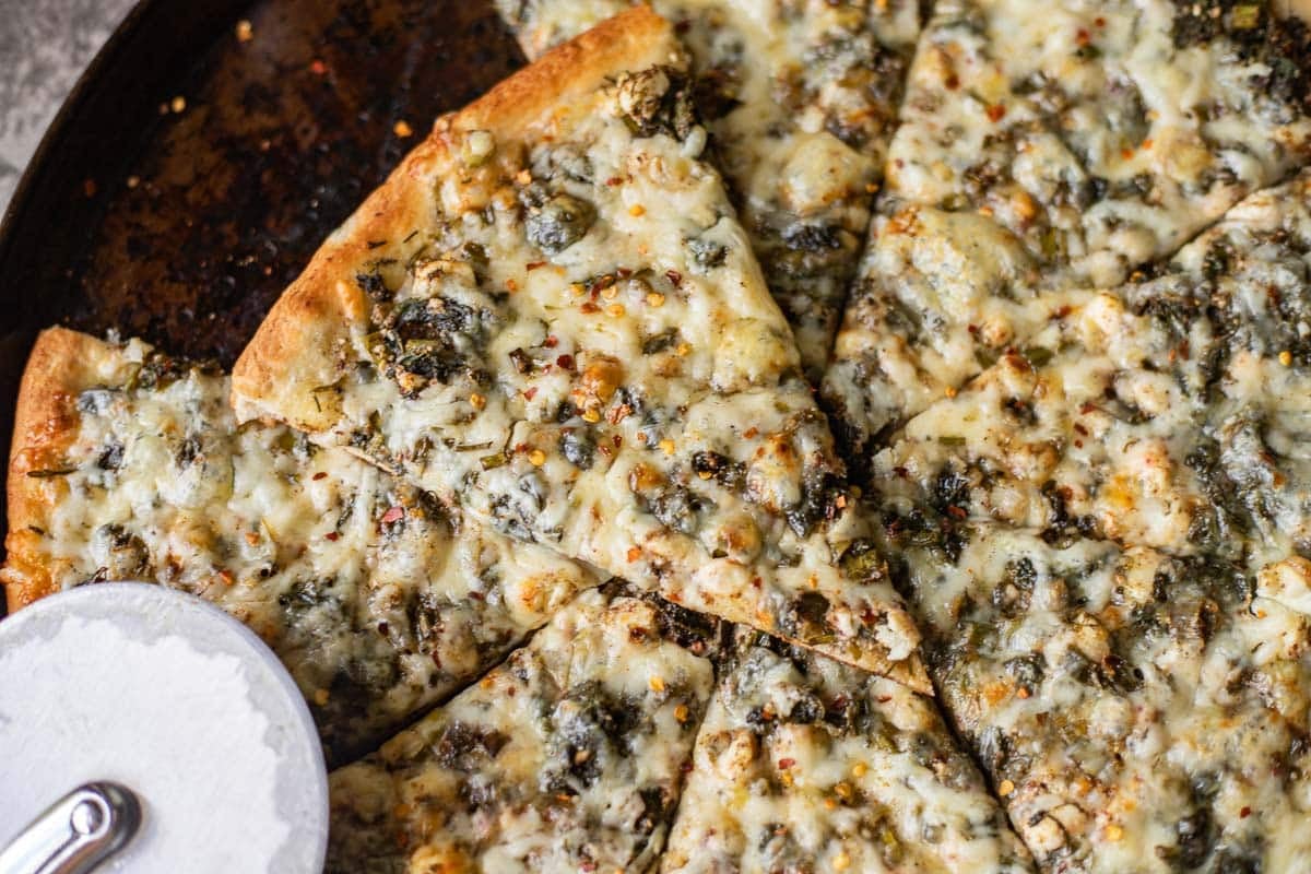 sliced spinach and feta pizza .
