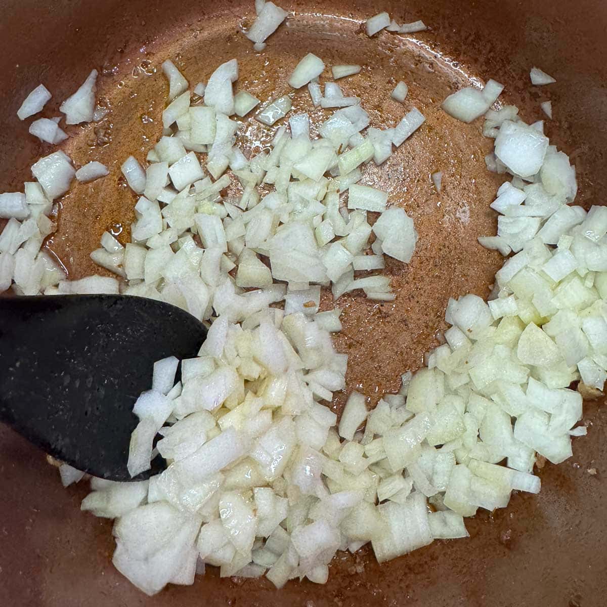 Diced onion in a pot. 