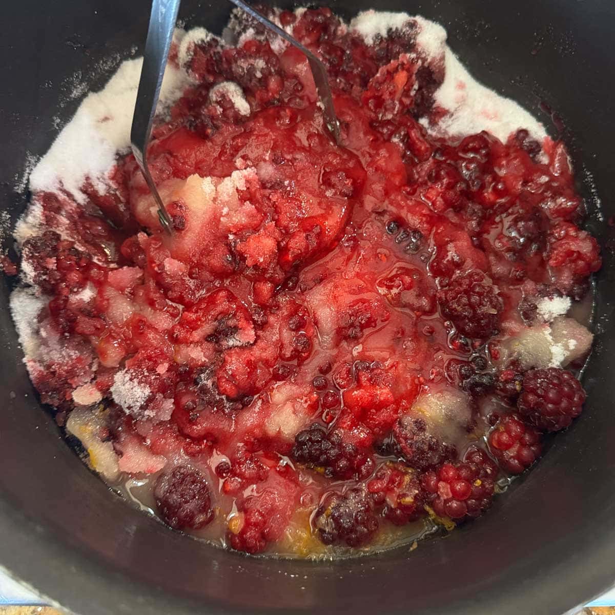 boysenberry jam ingredients in a pot.