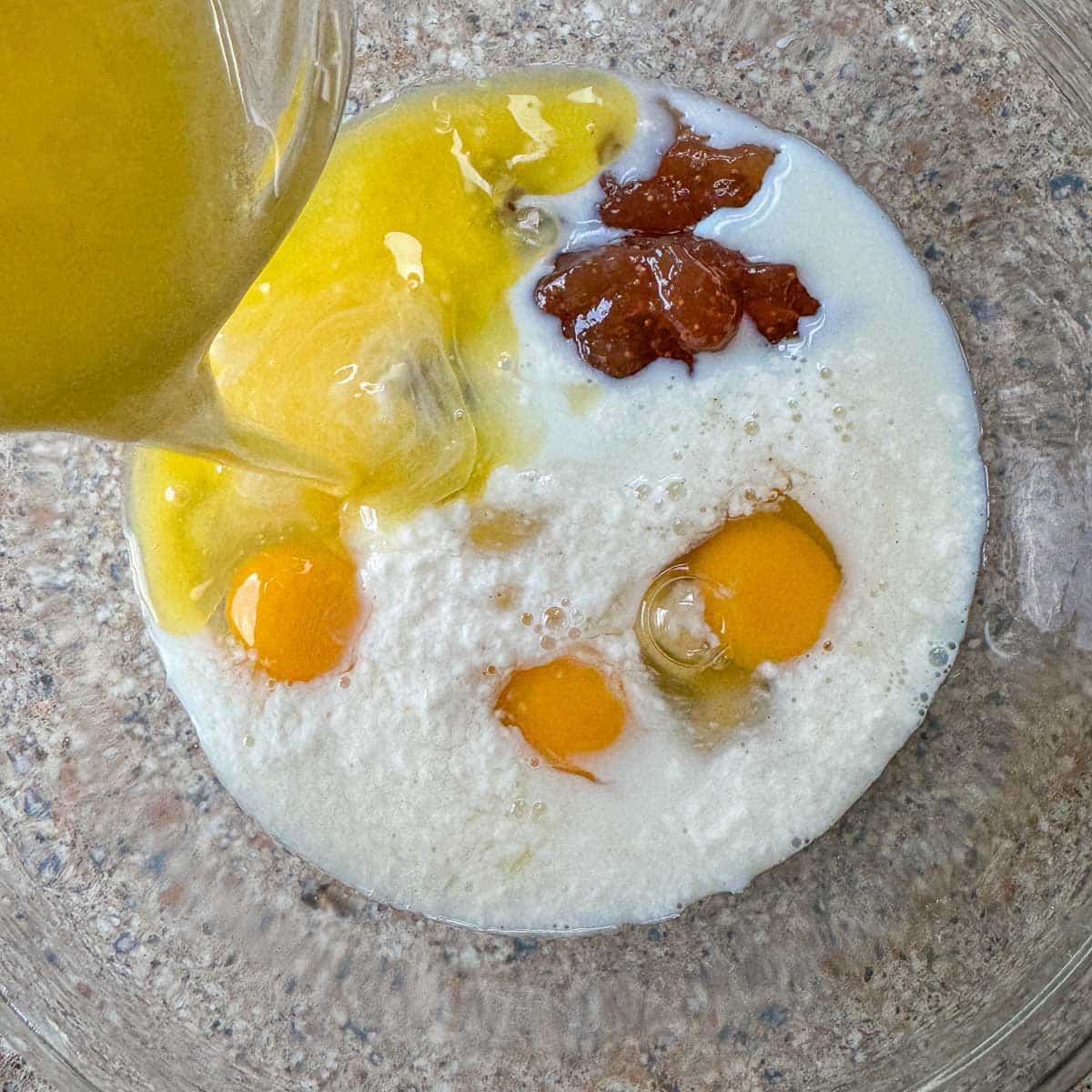 wet ingredients in a bowl for cake. 