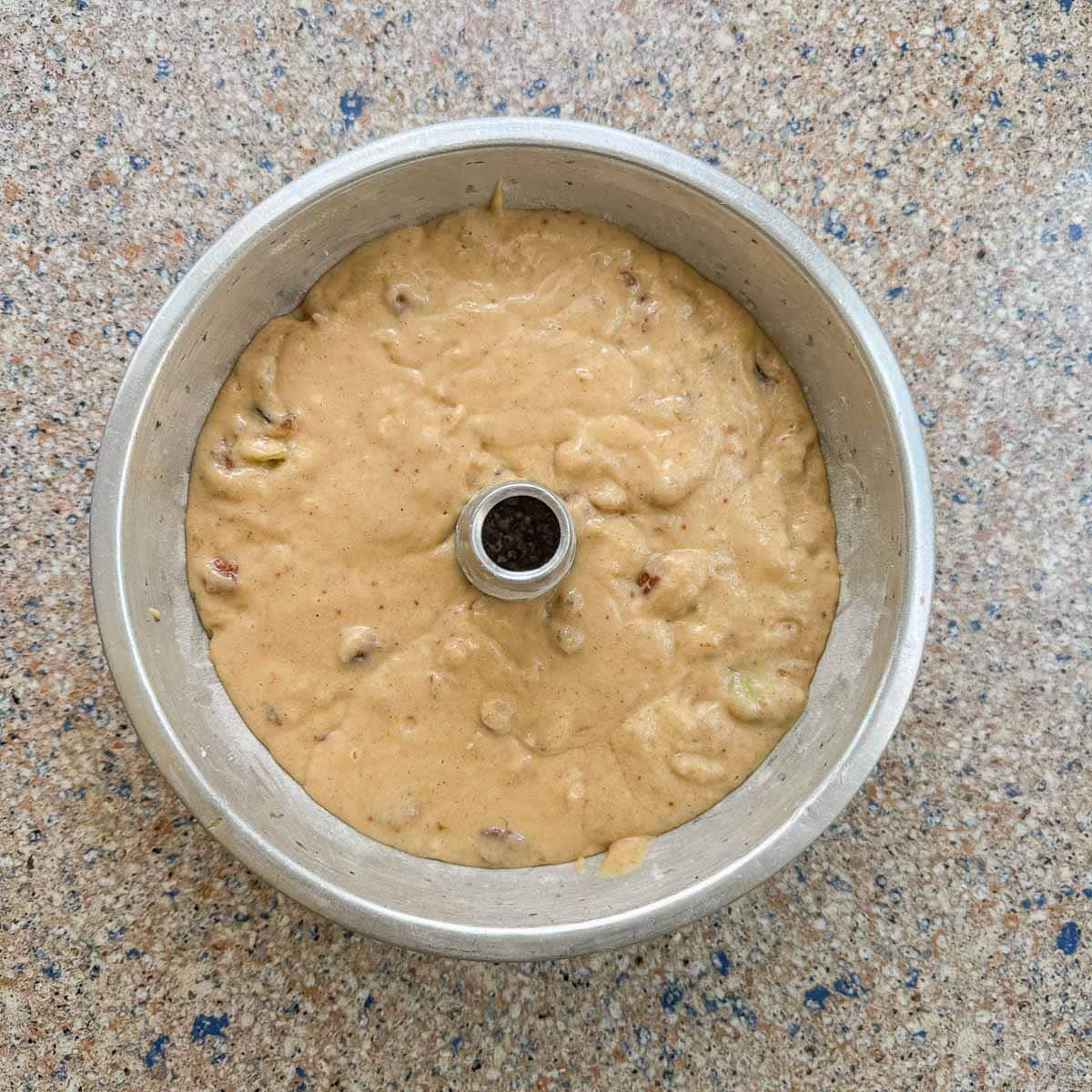 bundt cake pan with cake batter. 