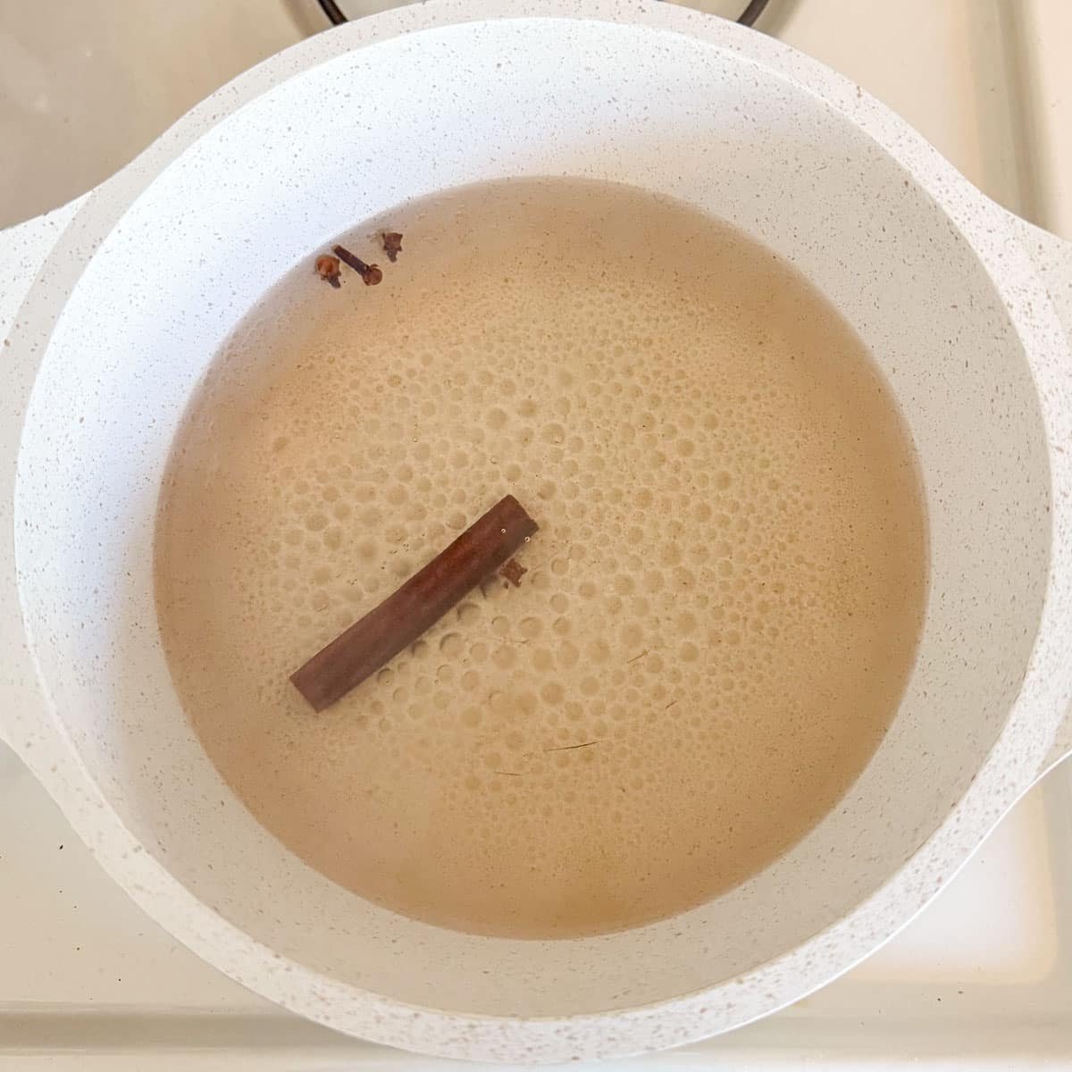 cinnamon and cloves in boiling water.