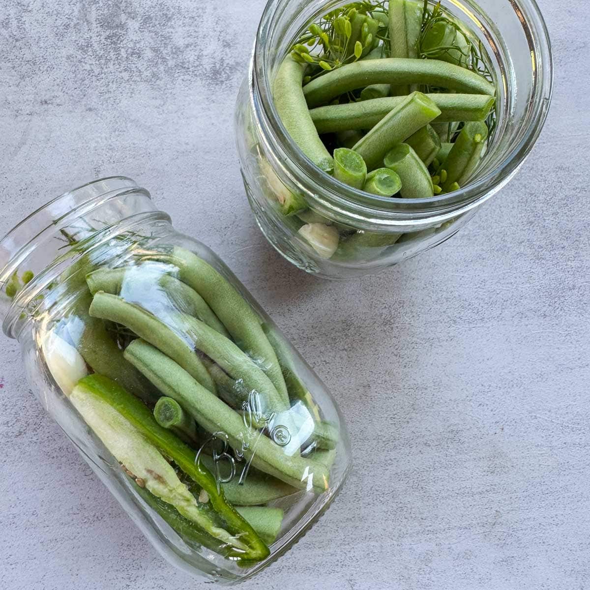 two jars with green bean.