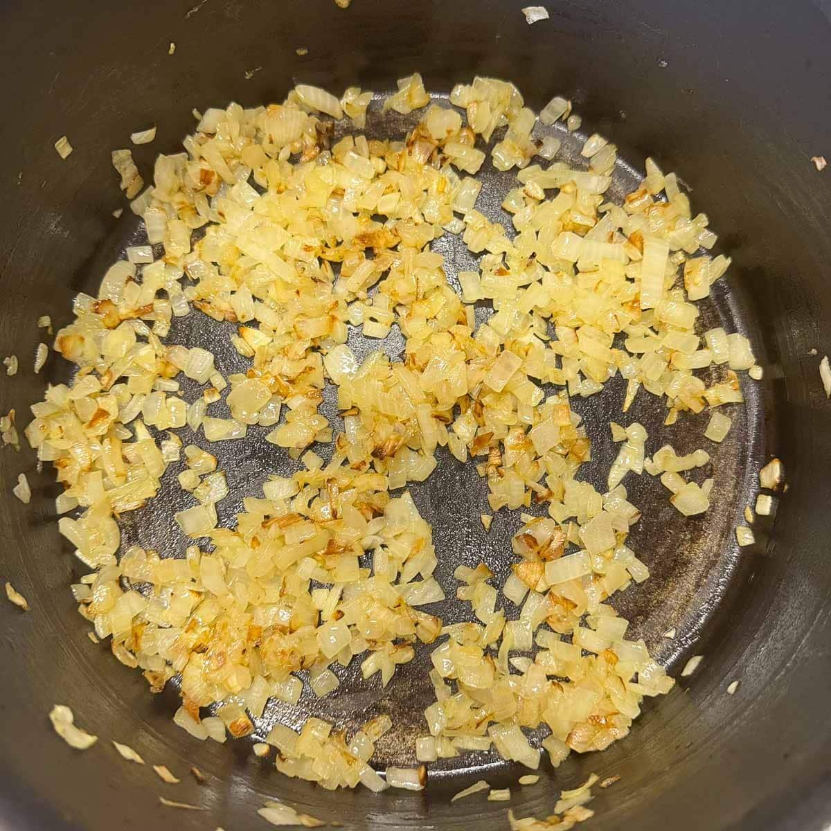 caramelized diced onions in a pot.