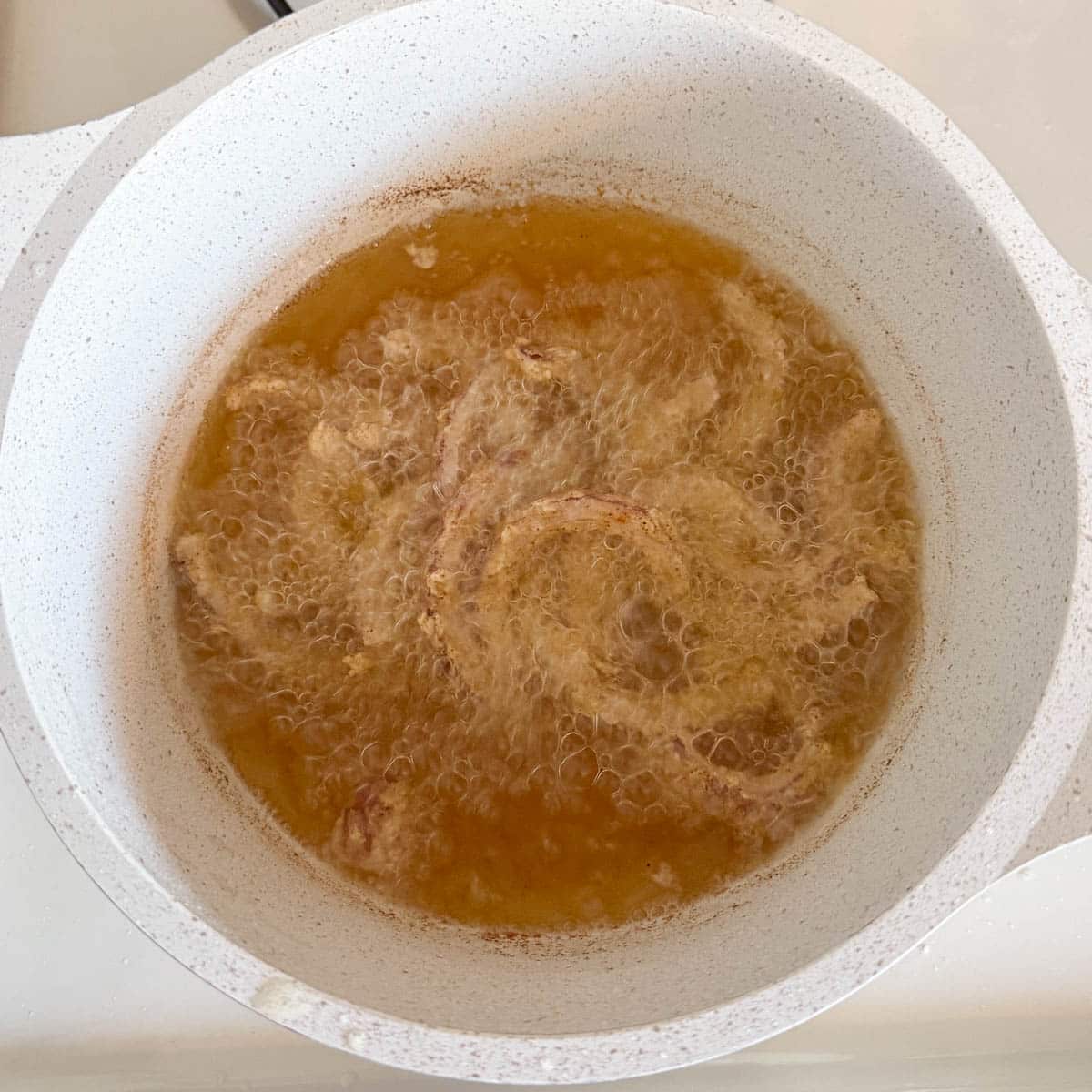 onions frying in oil.