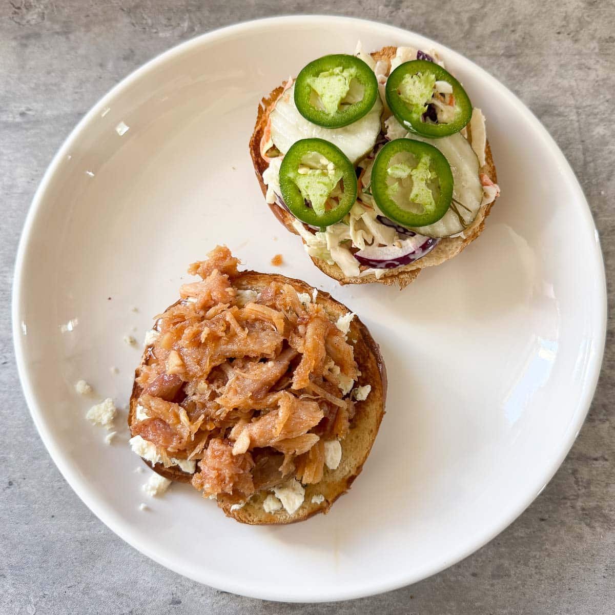 coleslaw and jalapenos added to sandwich before assembling top bun.