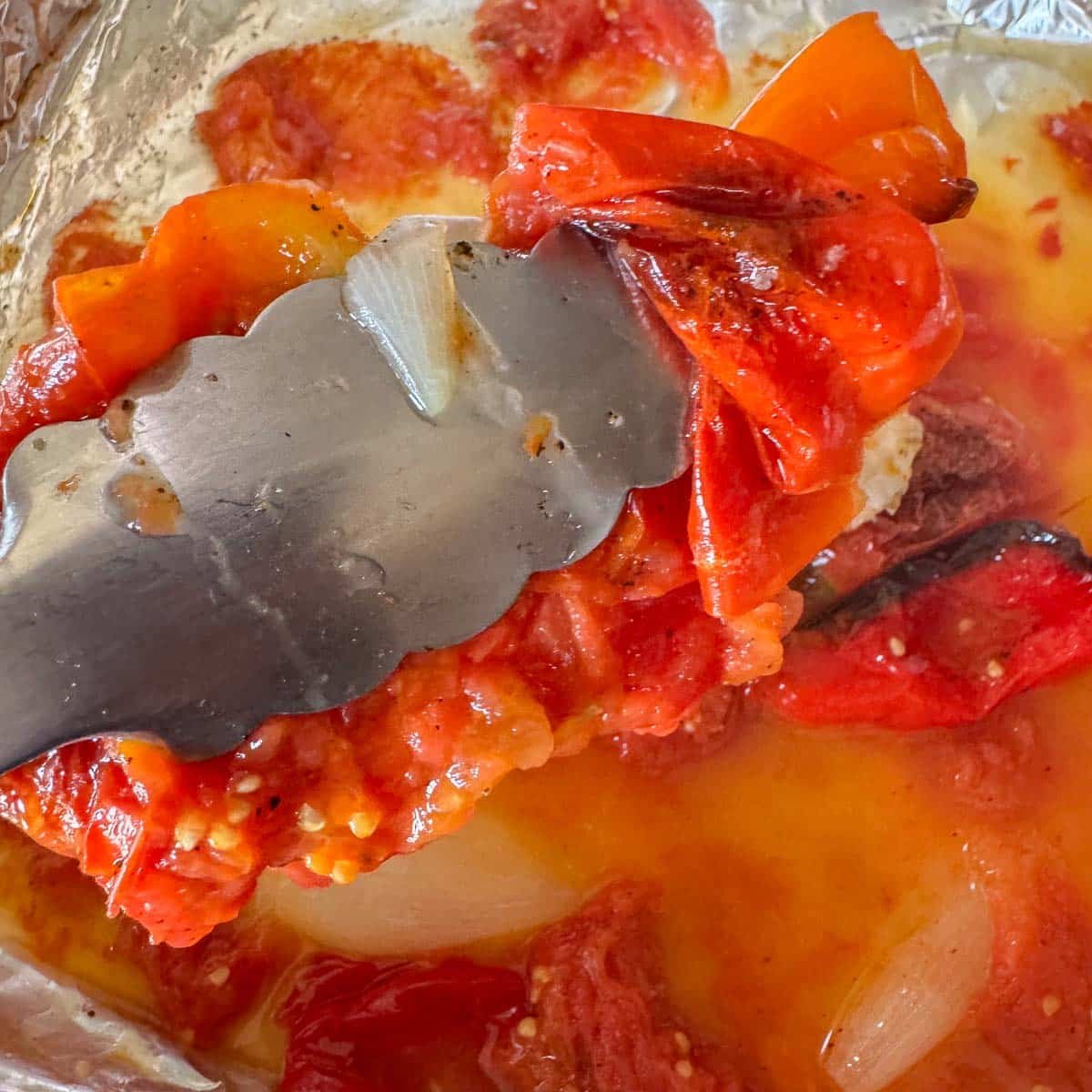 adding roasted veggies to a blender.