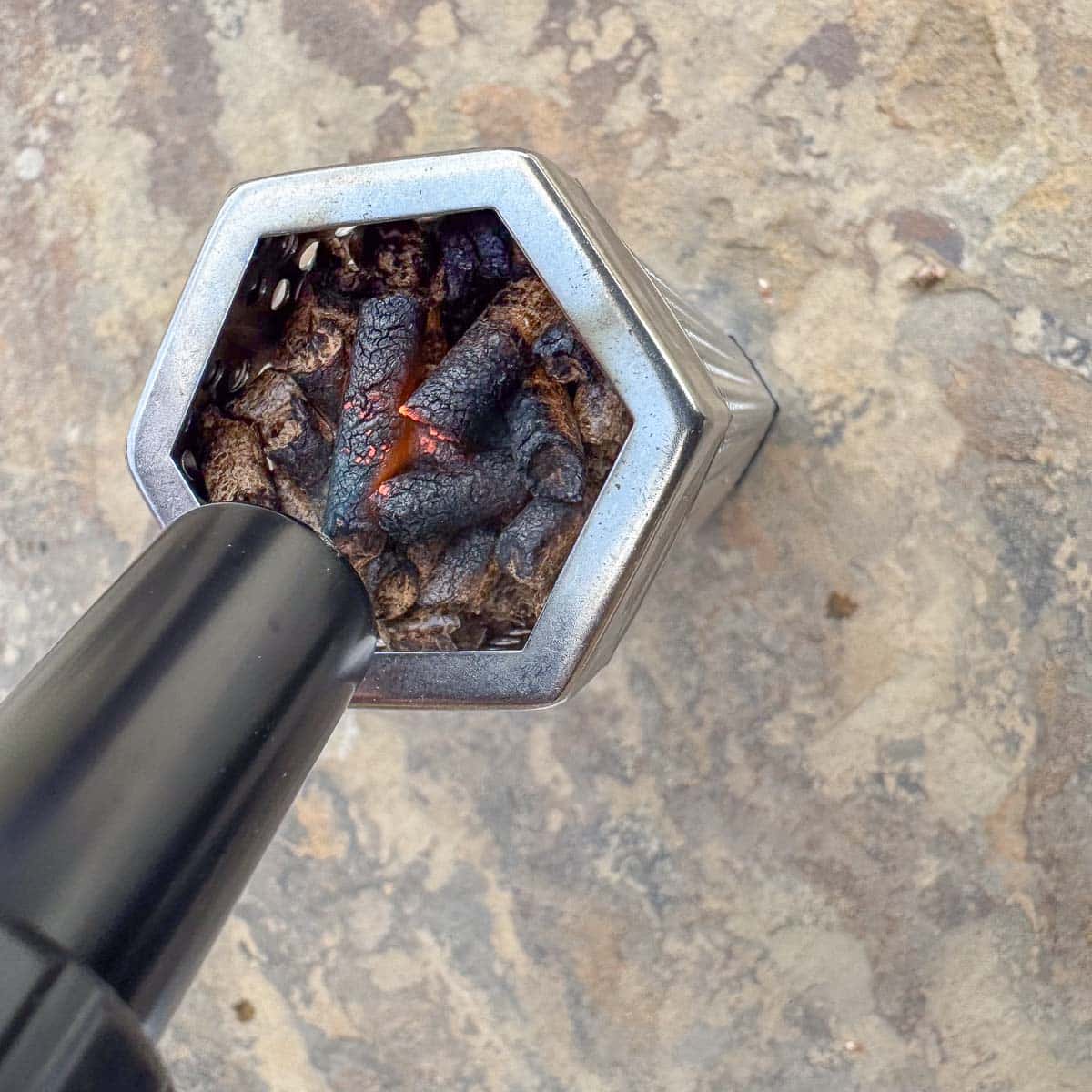 lighting pellets with a torch. 