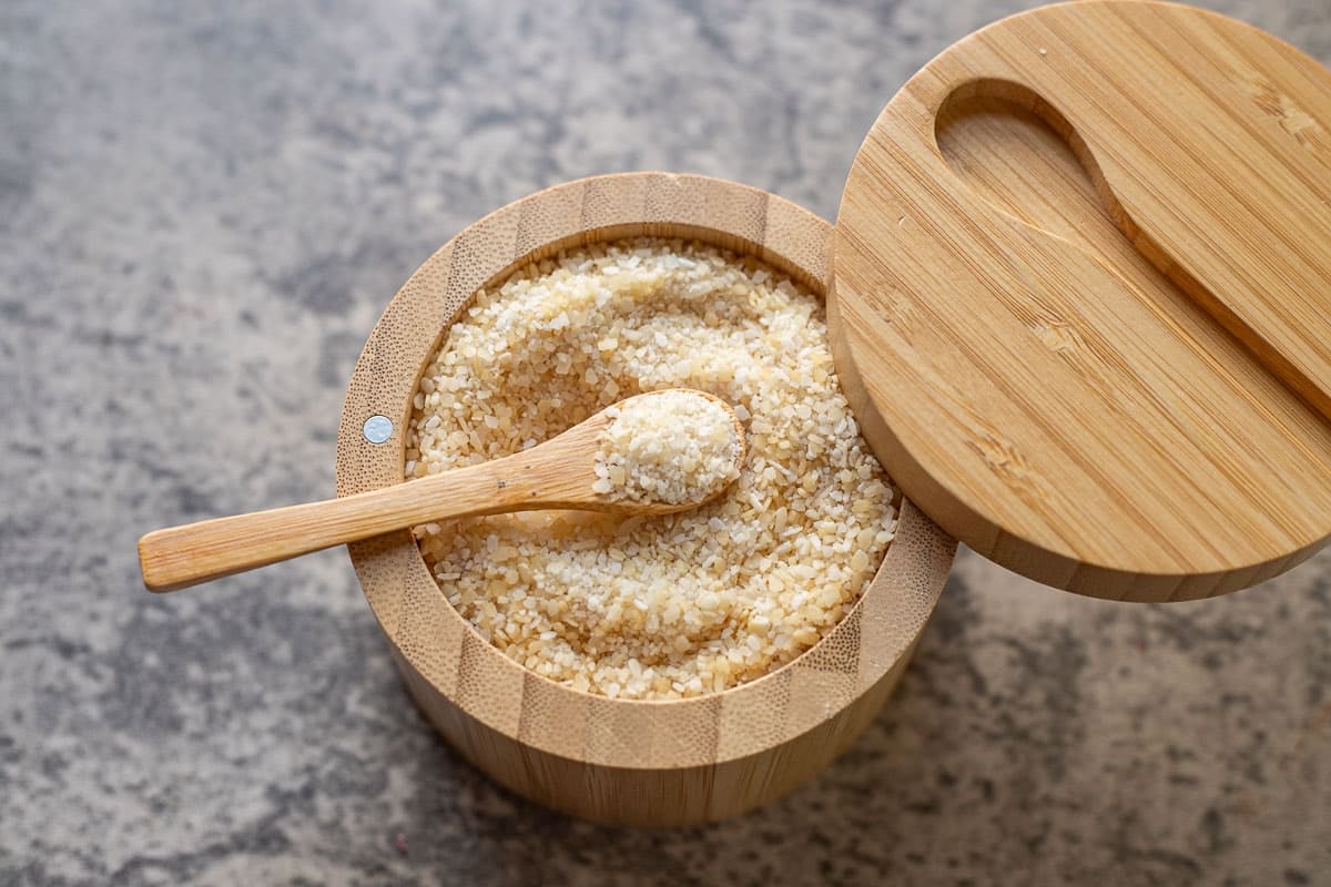 smoked salt in a wooden salt cellar.