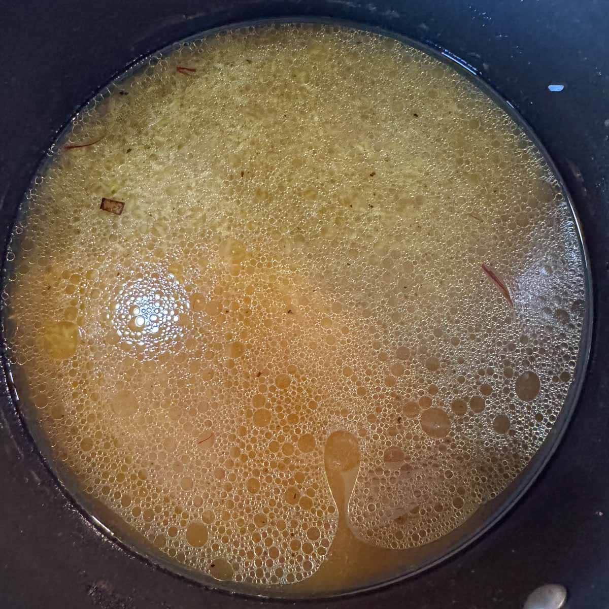 rice covered with broth and spices.